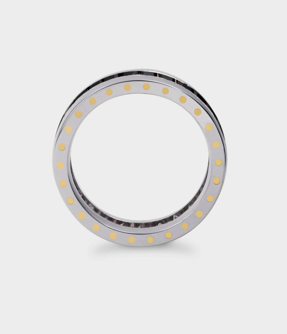 side view of a geo eternity ring showing the gold rivets in the ring